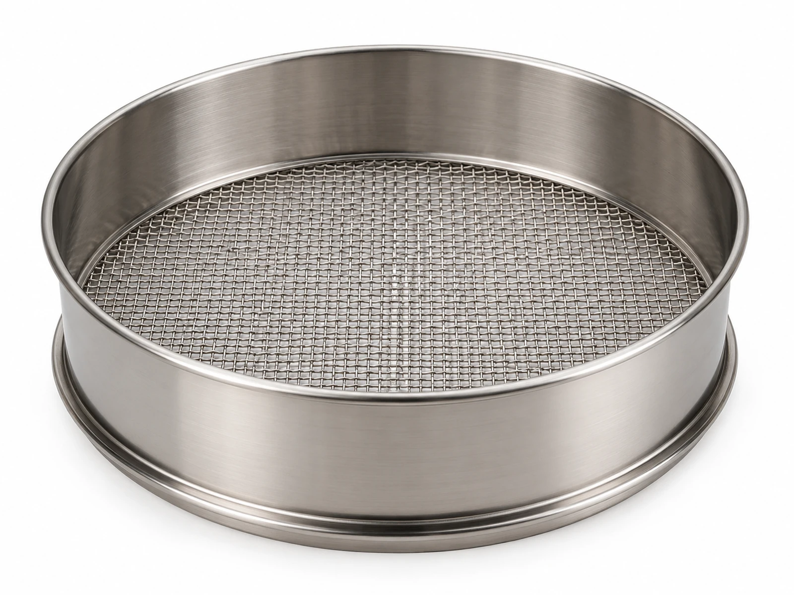 Several 8 inch ASTM E11 test sieves with brass and stainless frames stacked with a receiver pan, soil samples beside them