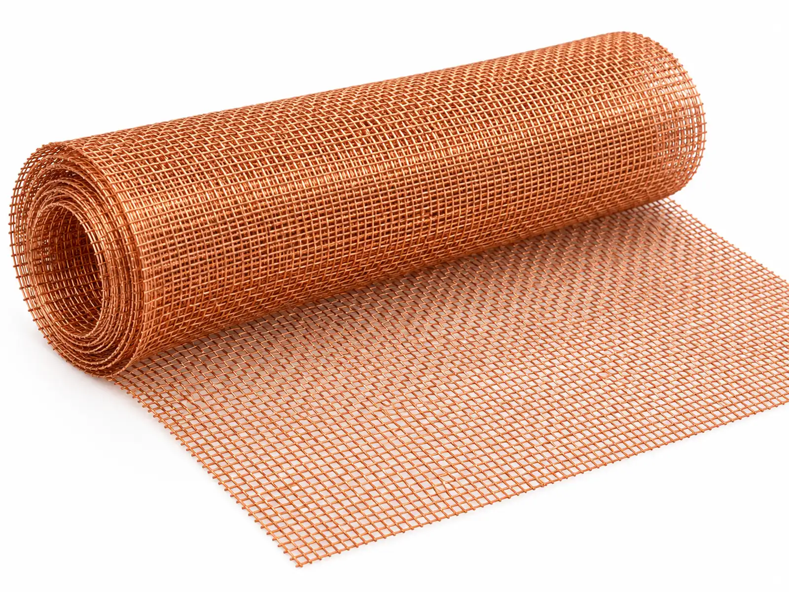 A roll of bright woven pure copper wire mesh partially unrolled on a light workbench, showing the fine square weave