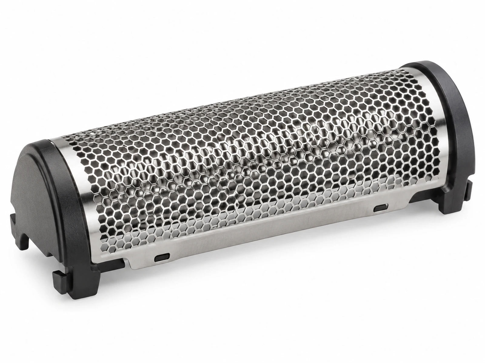 Extreme macro of an electric shaver head showing a curved thin silver foil with a pattern of tiny hexagonal holes