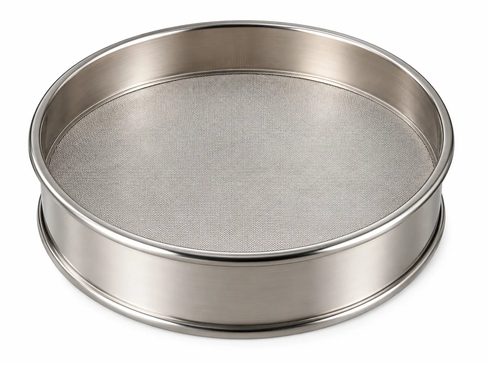 A small round laboratory sieve with a shiny electroformed nickel foil screen held in a stainless frame, ultrasonic bath