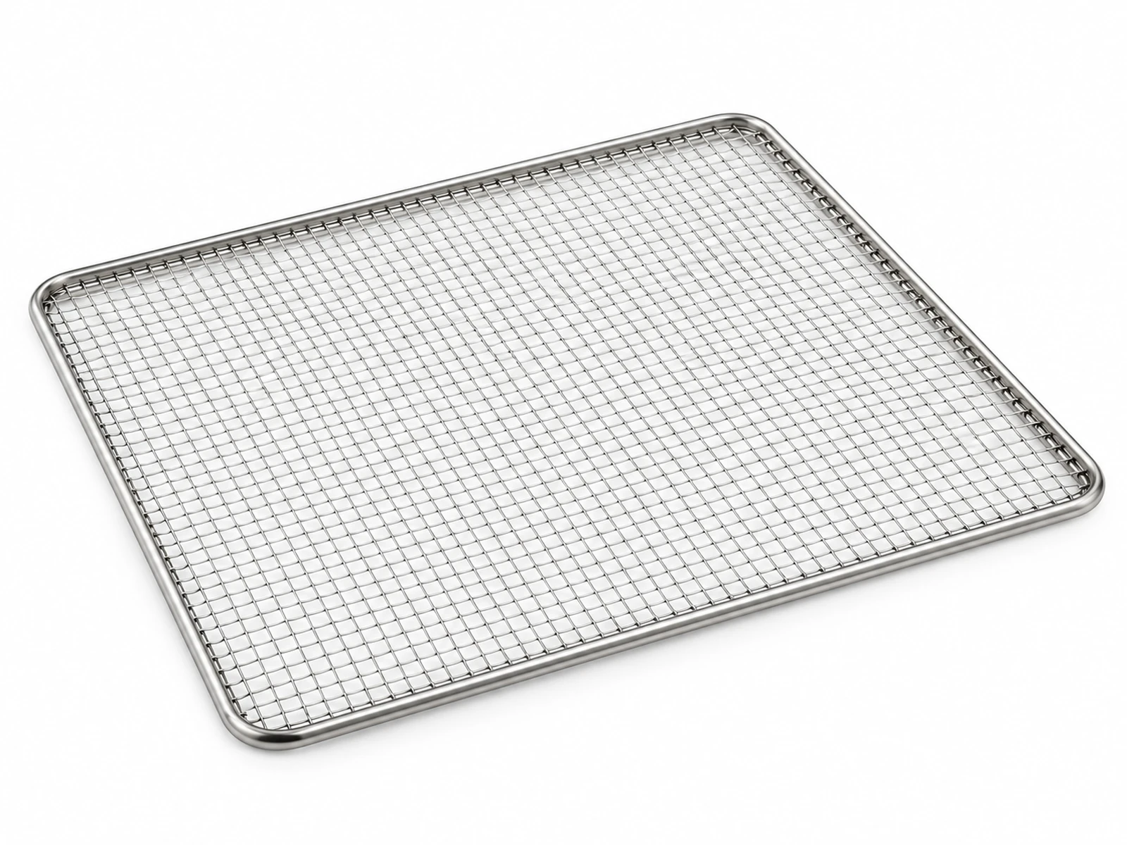 A stack of stainless steel mesh dehydrator trays with apple slices and jerky in a food dehydrator on a kitchen counter