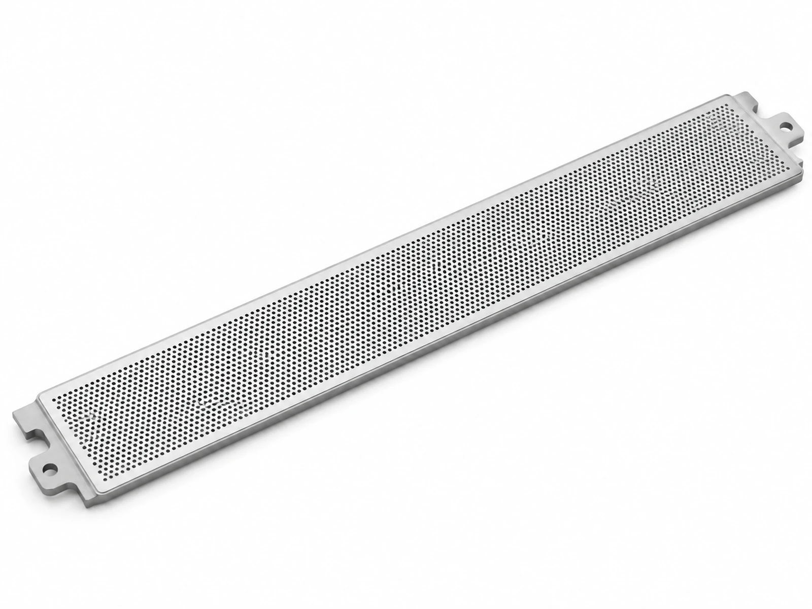 Angled close-up of a silver aluminum laptop keyboard deck with a strip of finely micro-perforated speaker grille