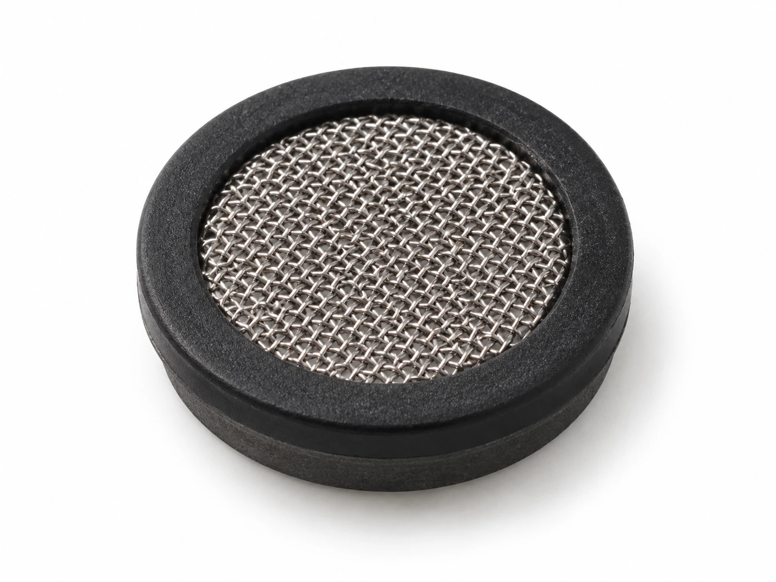 Macro photograph of several tiny round black etched stainless steel micro-mesh discs with white adhesive rings