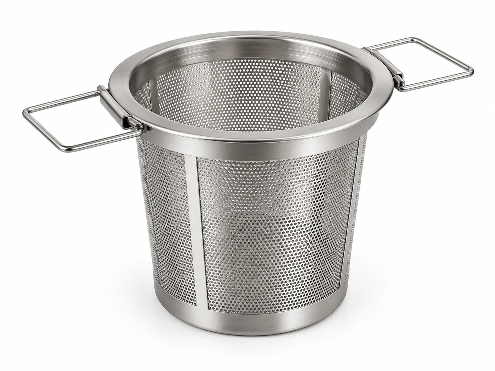 A stainless steel mesh tea infuser basket with folding handles resting on a white porcelain mug