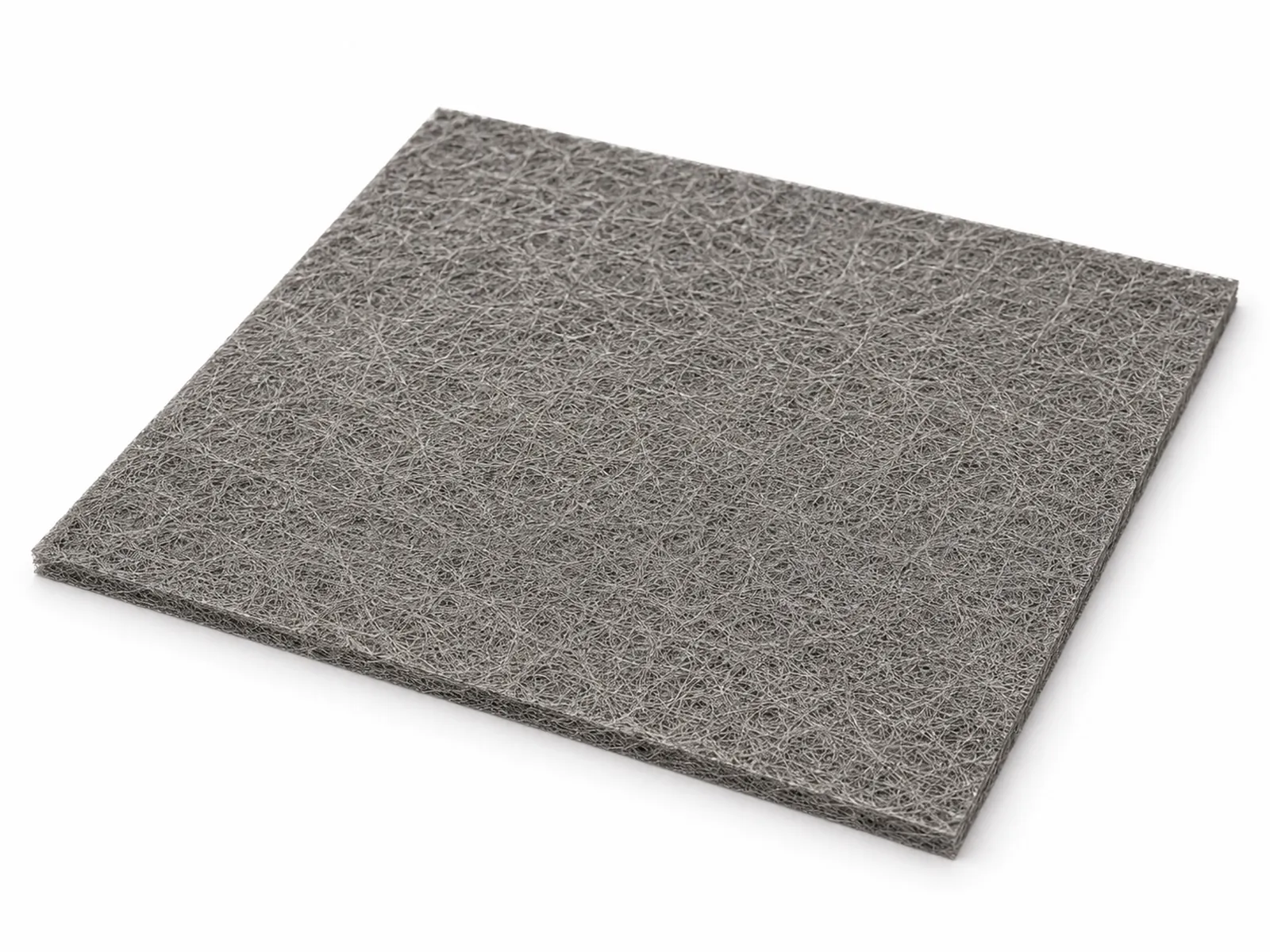 A square sheet of grey sintered titanium fiber felt with fine fiber texture beside a PEM electrolyzer stack component